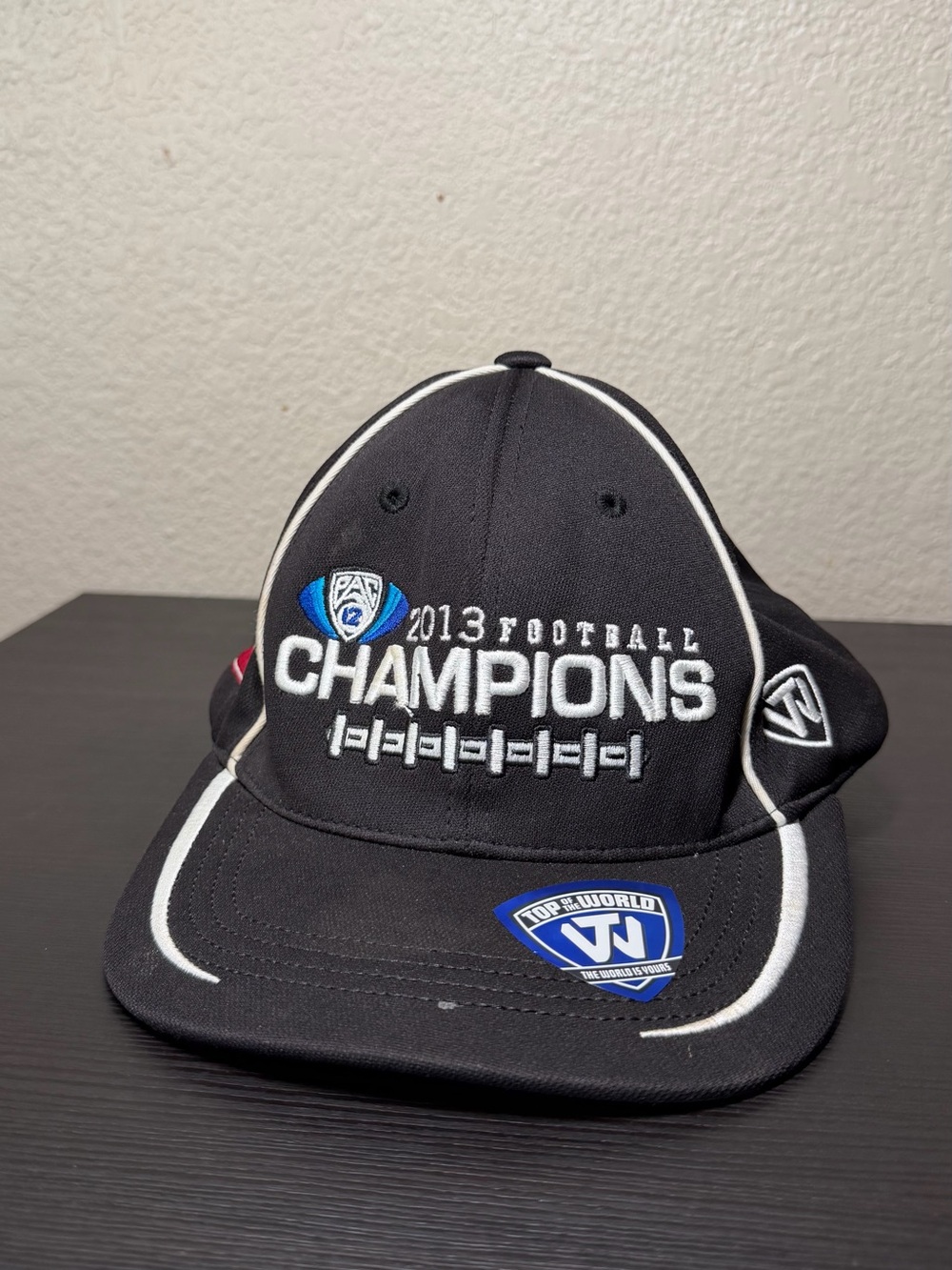 Top of the World Black Champions Embroidered Football Hat with White Piping
